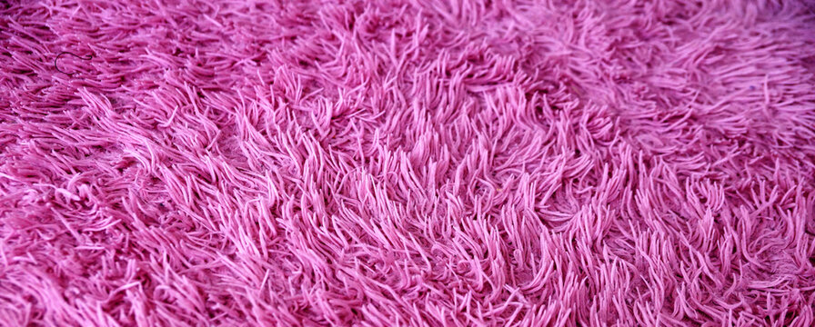 faux pink fur close up for textile background