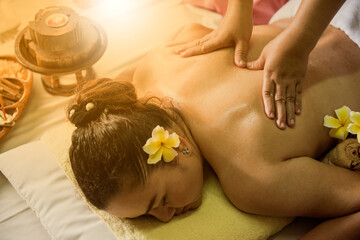 Beautiful women getting spa massage of shoulder and back body.