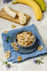 Bananas  frips. Dried bananas on jight background.