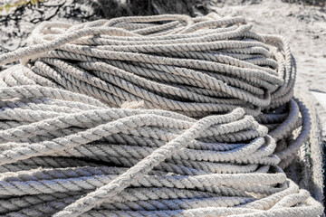 Fototapeta na wymiar traditional fishing net and rope on small rowing boat