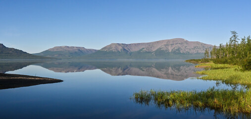 Naklejka na ściany i meble Panorama of a mountain lake on the Putorana plateau.