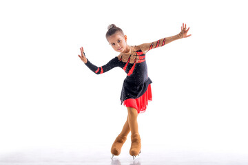 Little skater posing in red and black dress on ice isolat on white background