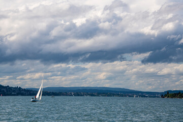 sailing boat on the sea on a cloudy and windy day