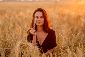girl in a wheat field at dawn