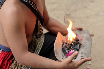 Someone is playing with fire during a traditional art performance in Central Java, Indonesia