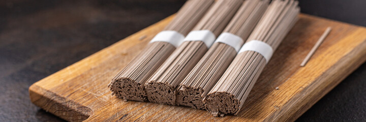 soba raw buckwheat noodles ready to cook portion meal snack on the table copy space food background rustic 