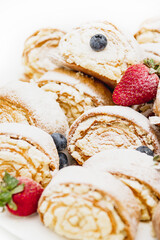 festive dessert with strawberry filling, sprinkled with powder. Delicious pastries.