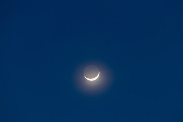 Earthshine is a soft, faint glow on the dark side of the moon. Earthshine occurs when sunlight reflects off the Earth's surface and illuminates the unlit portion of the Moon's surface. 