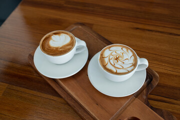 hot latte art coffee on wood table, relax time