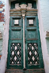 Vintage green door. Aesthetics of architecture.