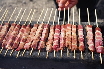 Typical sheep skewers (arrosticini) from Abruzzo on the barbecue