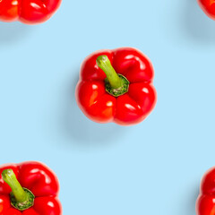 seamless pattern of bulgarian red pepper on blue background. paprika wallpaper, sweet pepper print pattern, top view, flat layout, isolated.