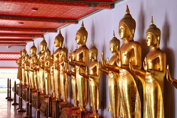 Fototapeta premium The Buddha statue in the standing posture at Wat Pho also spelled Wat Po, is a Buddhist temple in Bangkok, Thailand.