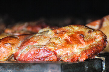 Close up  grilling smoking meat  outdoors.