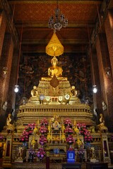 Fototapeta na wymiar Phra Buddha Theva Patimakorn, The Principle Buddha Image in the Main Chapel of Wat Pho also spelled Wat Po, is a Buddhist temple in Bangkok, Thailand.