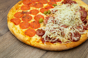 Pizza half peperoni and half calabrian. Top View.