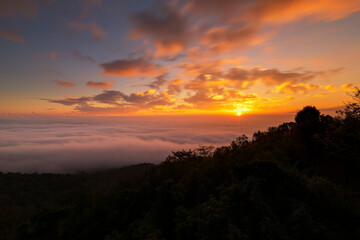 Beautiful sunrise at misty morning mountains