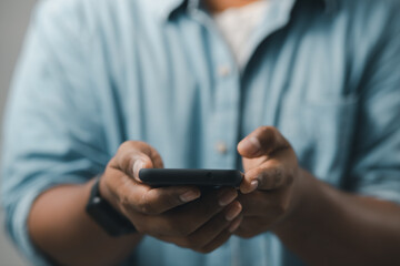 concept of mobile technology Businessmen use smartphones while working at home or office.
