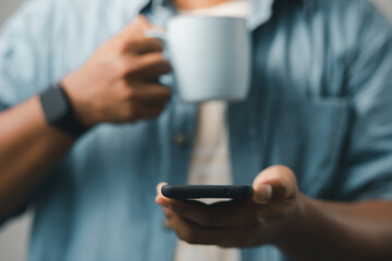 concept of mobile technology Businessmen use smartphones while working at home or office.
