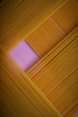 dry spaghetti on pink background ,close up ,graphic design