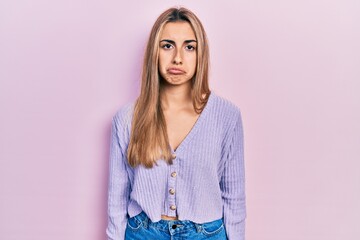 Beautiful hispanic woman wearing casual shirt depressed and worry for distress, crying angry and afraid. sad expression.