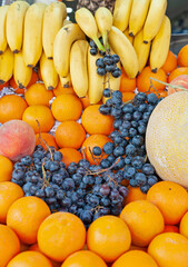 Grape, orange, banana, melon, peach fruits stock photo