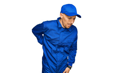 Bald man with beard wearing builder jumpsuit uniform suffering of backache, touching back with hand, muscular pain