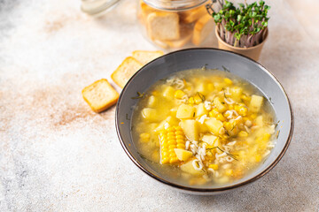 soup vegetables corn, potatoes, pasta alphabet, broth no meat fresh portion meal snack on the table copy space food background rustic. top view keto or paleo diet veggie vegan or vegetarian food