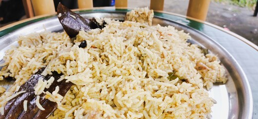 The biryani rice is yellow in color.