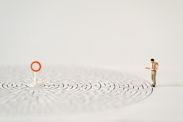Miniature Business people office man stand entrance of maze thinking business plan how to solve problem using for Accounting Financial Banking business growth development and Commerce Strategy Plan
