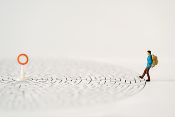 Miniature people Group of young tourist traveler traveling standing entrance of maze going around the world business trip traveler adviser agency or online world wide marketing new transportation 