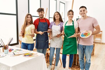 Group of people smiling happy drawing at art studio.