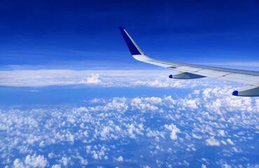 Fototapeta na wymiar clouds view from an airplane, window airplane in the clouds. above the clouds.