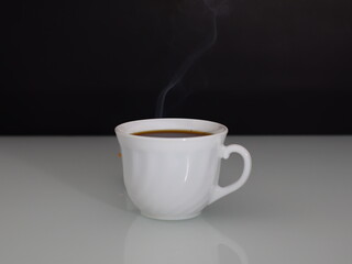 hot coffee steam on a dark background copy space.