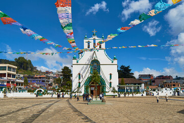 Church of San Juan Chamula, with tourists around. Tourism in Mexico concept. - obrazy, fototapety, plakaty