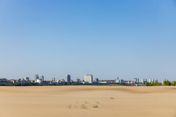 view of the city of Volgograd (city center) from the island located in the middle of the Volga River in the center on a sunny summer day