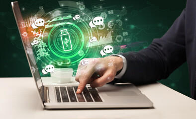 Business hand typing on a modern laptop