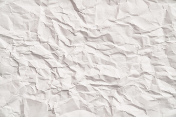 White crumpled paper texture with wrinkles. Damaged and torn sheet