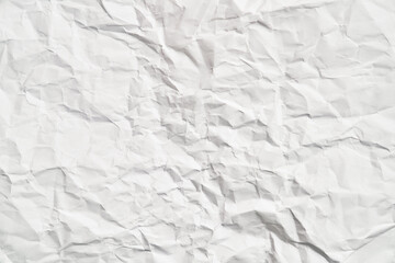White crumpled paper texture with wrinkles. Damaged and torn sheet