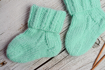 Mint color small newborn socks made of  soft cotton yarn
