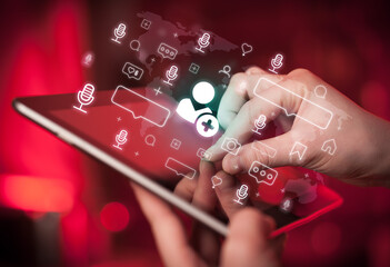 Close-up of a hand using tablet, social media concept