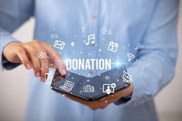 Businessman holding a foldable smartphone, social media concept