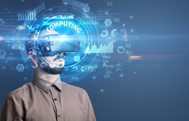 Businessman looking through VR glasses
