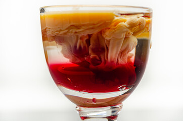 Interesting drink shot based on cream, liqueur and grenadine called Brain Hemorrhage prepared for Halloween party