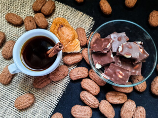 Coffee with cinnamon, croissants and chocolate. Top view