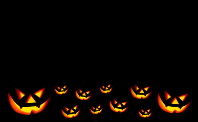 Scary face on black background. Jack-o-lantern in the dark