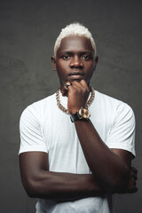 Cool african man with white hairs against gray background