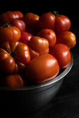 juicy red tomatoes close-up in a bowl