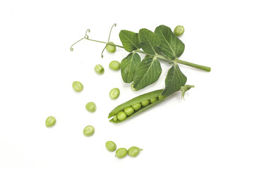 Pods of green peas with leaves isolated on white background
