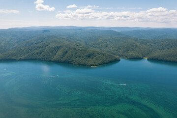 The Angara River is a major river in Siberia leaving Lake Baikal near the settlement of Listvyanka. Panoramic aerial view.